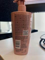 Kérastase Chroma Absolute bottle on bathroom counter for daily care.
