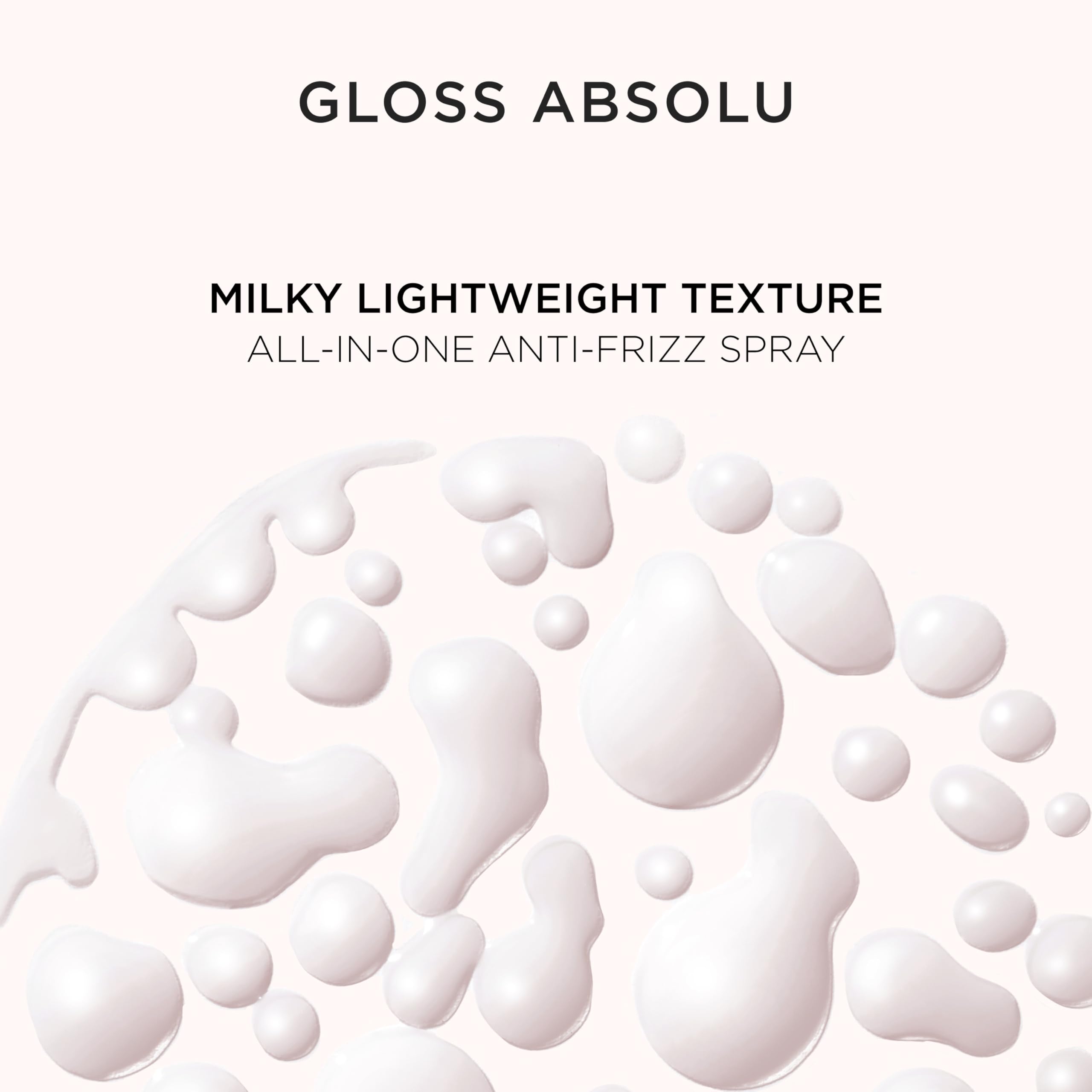 Kerastase Gloss Absolu Glaze Milk travel-friendly bottle sits on vanity.