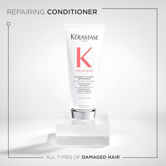 Applying Kerastase Premiere to damp hair for dual-action repair.