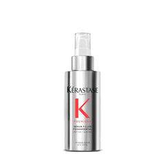 Kerastase Premiere serum bottle pouring for smooth hair and frizz control.