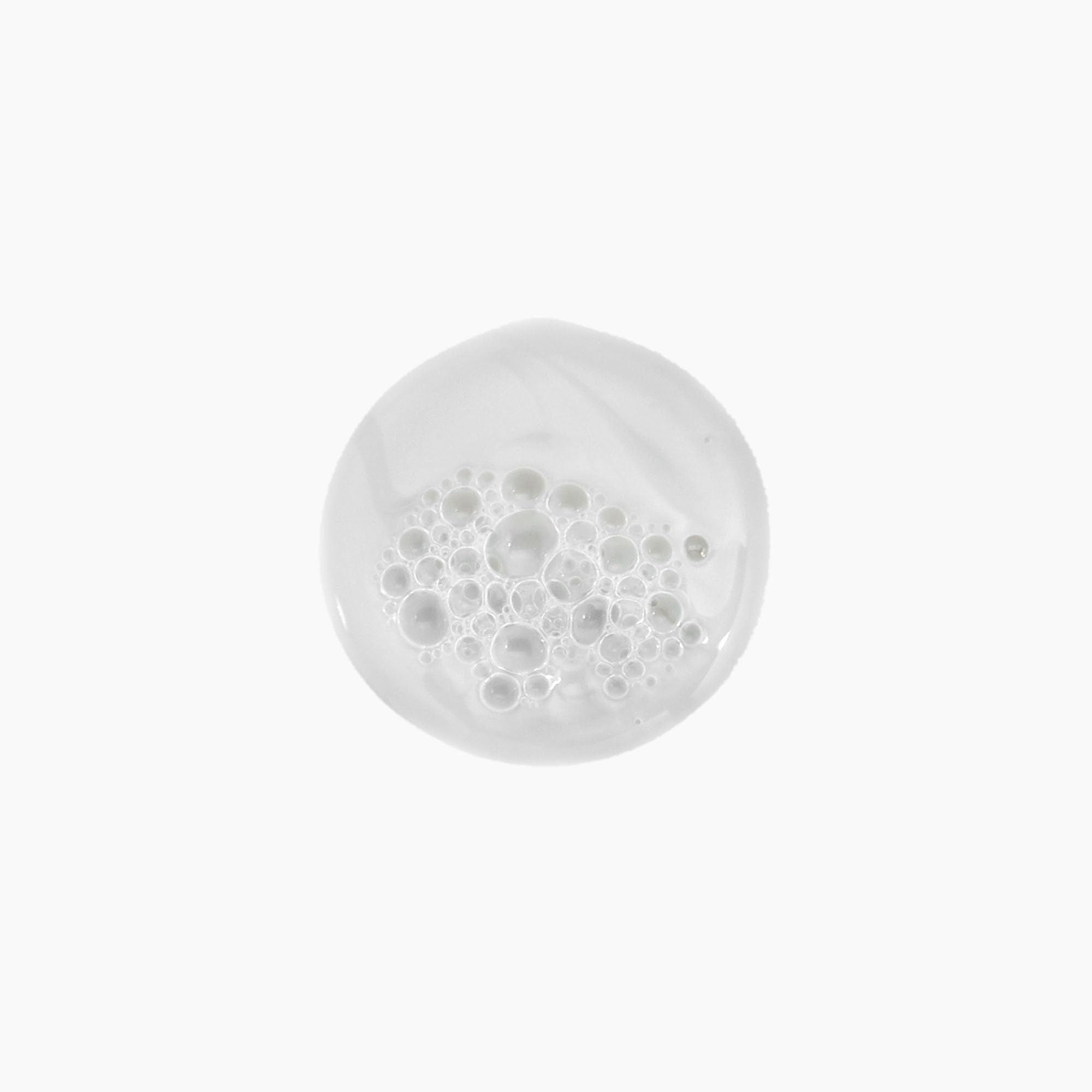 Kevin Murphy Young Again Wash pour shows easy dispensing for clean, soft strands.