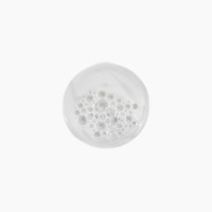 Kevin Murphy Young Again Wash pour shows easy dispensing for clean, soft strands.