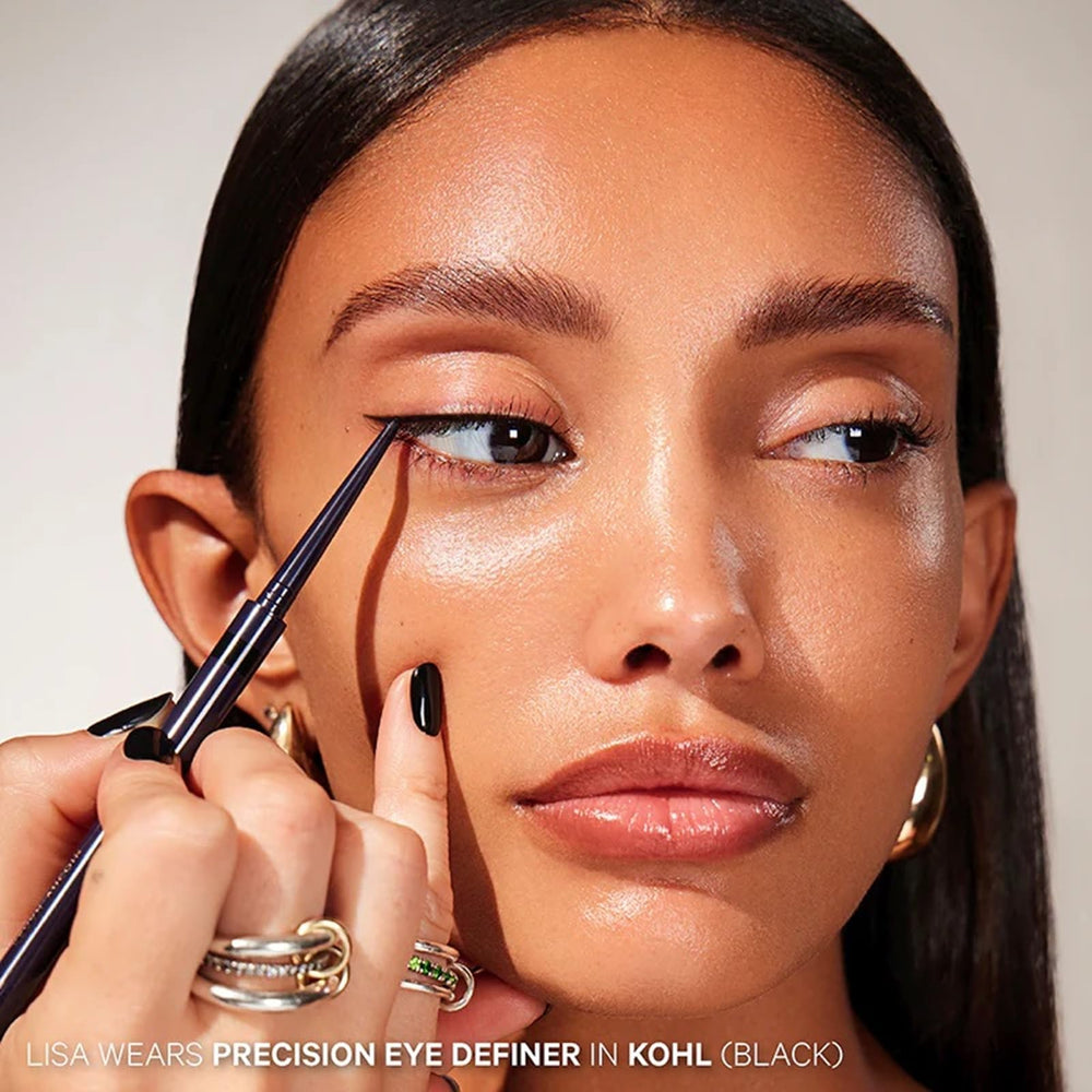 Applying Kevyn Aucoin Precision Eye Definer along the waterline for long-wear definition.