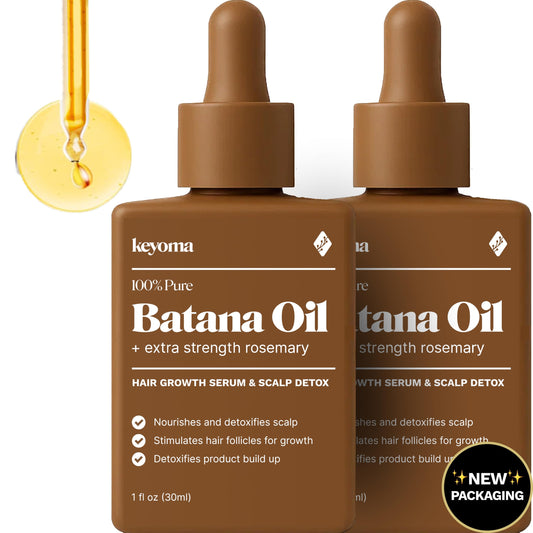 Keyoma Batana Oil bottle pour showcases pure organic formula for hair nourishment.