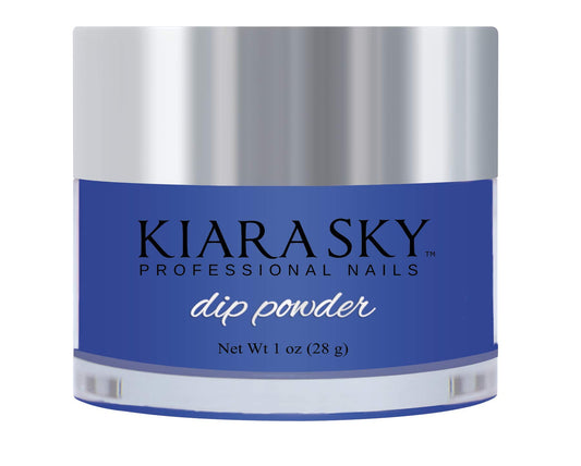 Kiara Sky Blue Me Away dip powder jar close-up showing a rich cobalt color for DIY manicure.