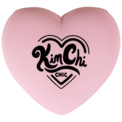 Heart-shaped KimChiChic compact close-up with mirror for precise application.