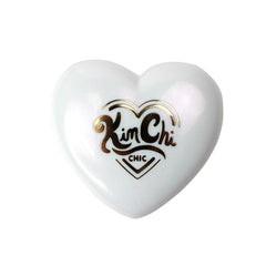 KimChiChic Pearl Gone Wild highlighter in compact with mirror for easy touch-ups.