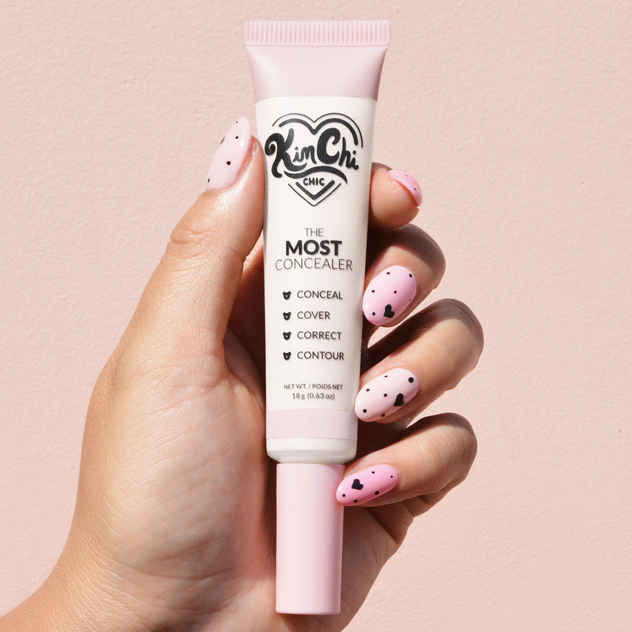 KimChiChic The Most Concealer built-in brush demonstrates precise blending.