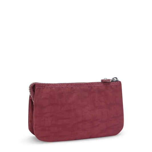 Kipling Creativity Large Pouch held in hand for portable on-the-go storage