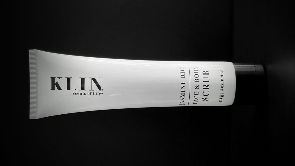 KLIN Jasmine Rice Scrub in use image showing circular massage on skin.