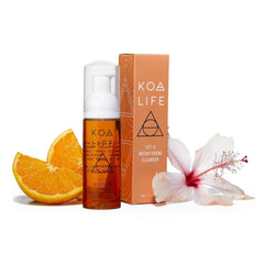 KOA LIFE Vit-C Illuminating Cleanser bottle on a bathroom counter for a refreshing morning cleanse