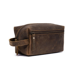 KomalC travel toiletry bag in buffalo leather close-up showing rugged, travel-ready craftsmanship.