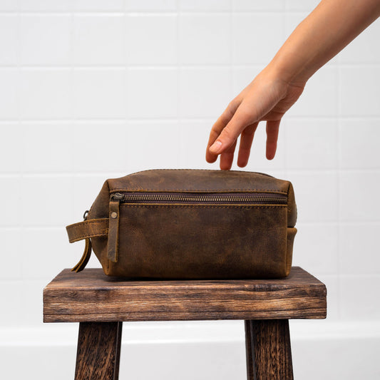 KomalC travel toiletry bag with water-resistant lining protecting contents on the go.