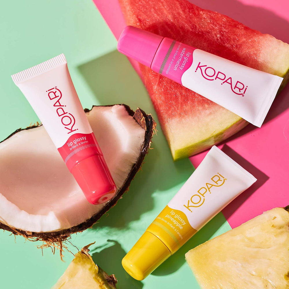 Kopari Lip Glossy coconut-vanilla flavor notes add tropical feel.