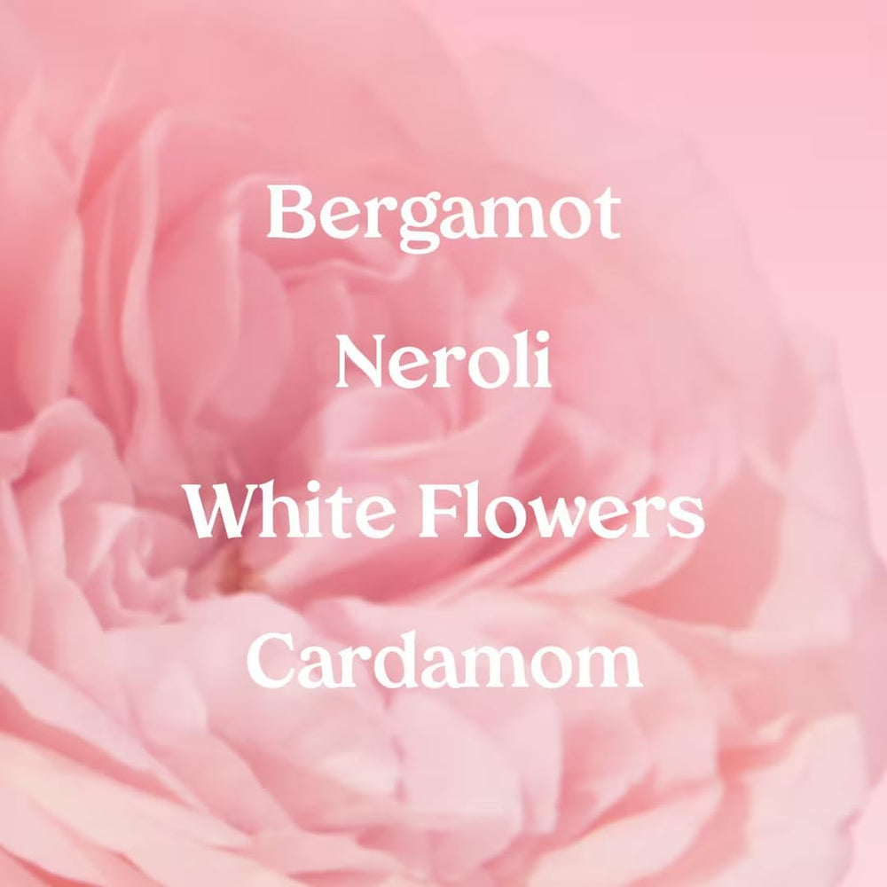 Kopari Marbella Bloom spray action illustrating easy day-to-night fragrance application