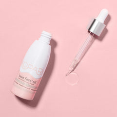 Kopari Save Face Oil bottle pour close-up showing lightweight texture