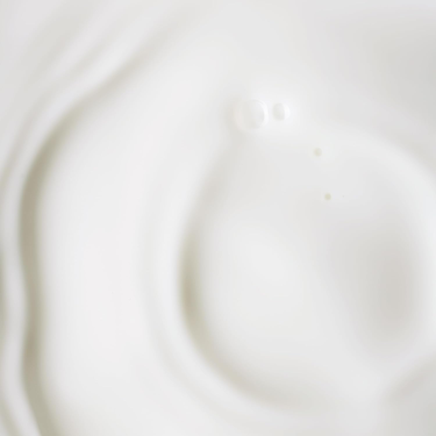 KORA Organics Serum Dropper application demonstrating gentle, day-and-night care.