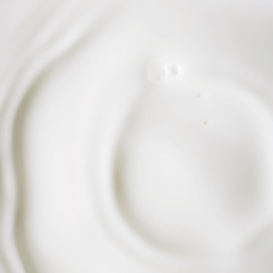 KORA Organics Serum Dropper application demonstrating gentle, day-and-night care.