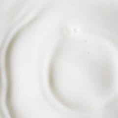 KORA Organics Serum Dropper application demonstrating gentle, day-and-night care.
