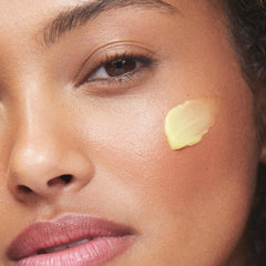 KORA Organics Turmeric Glow Moisturizer texture swirl for smooth application.