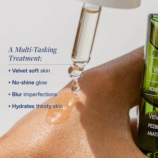 KORRES Santorini Grape Velvet Skin Drink dropper ready for precise application.