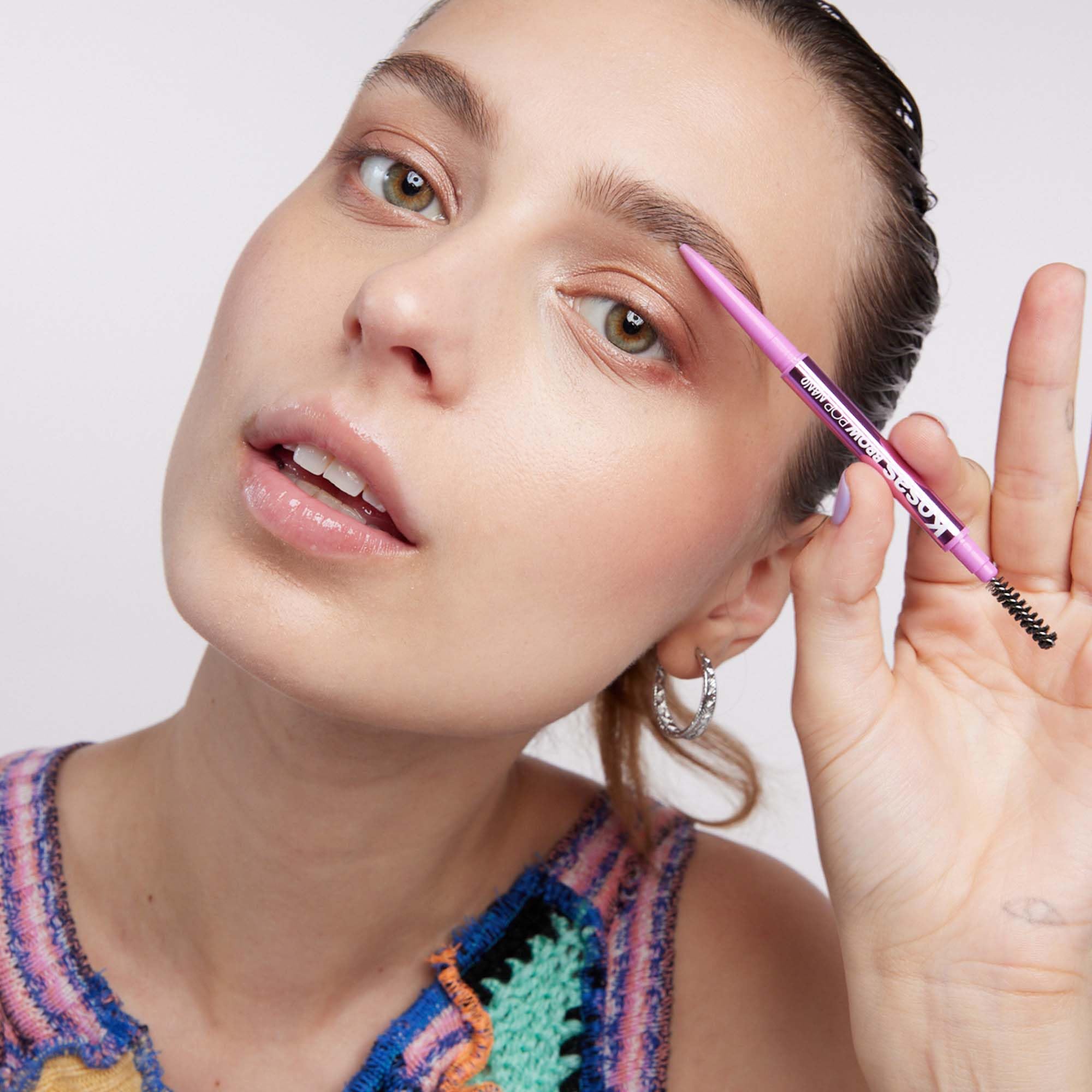 Kosas Brow Pop Nano shade medium-brown for subtle, everyday definition.
