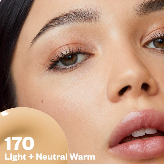 Kosas Revealer swatch on hand shows skin-matching tone and natural appearance.