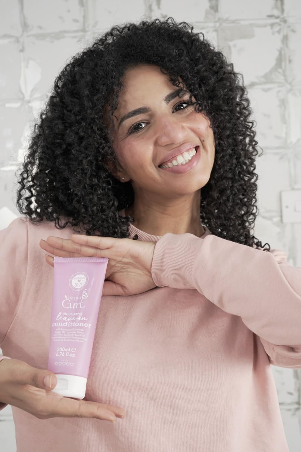 Kozma Curl apply-in-wet-hair demonstrates detangling-ready slip during wash day.