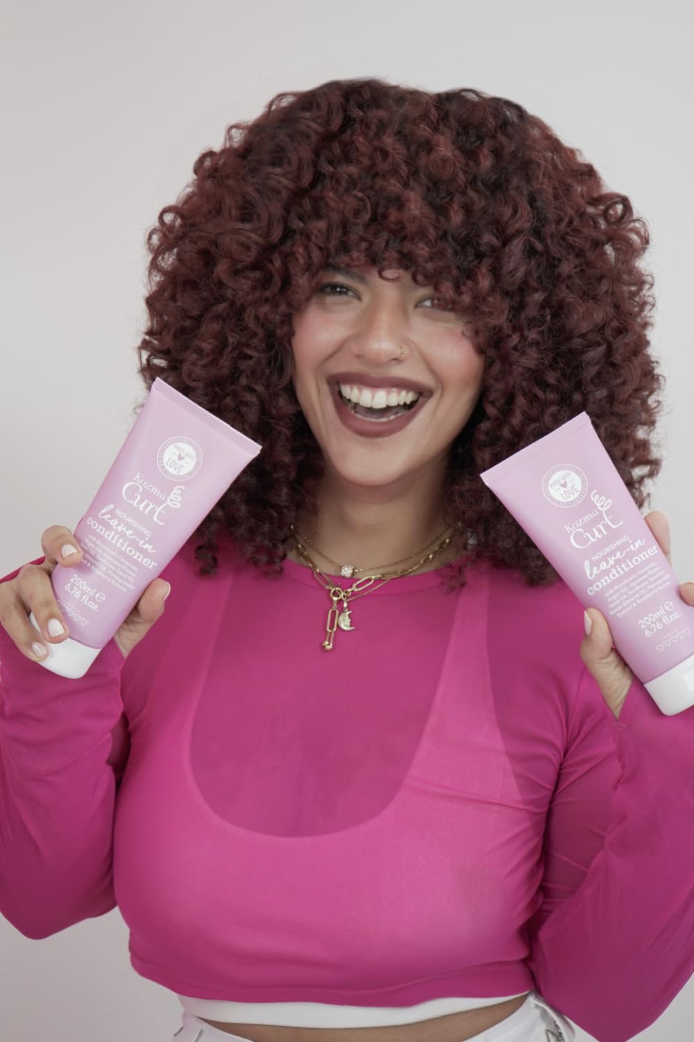 Kozma Curl Nourishing Leave-In dispensing cap enables easy, mess-free application on damp hair.