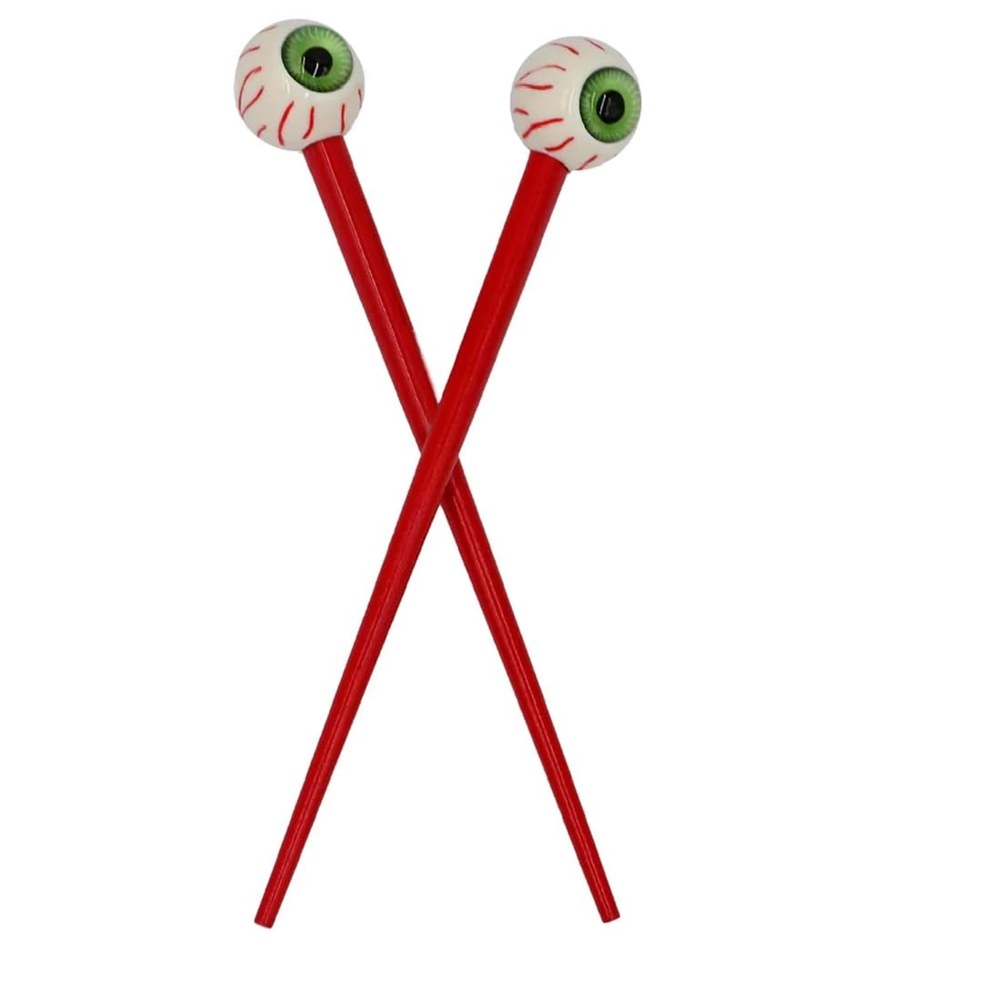 Kreepsville 666 creepy green eye ball hair sticks close-up, a bold gothic accessory for Halloween looks
