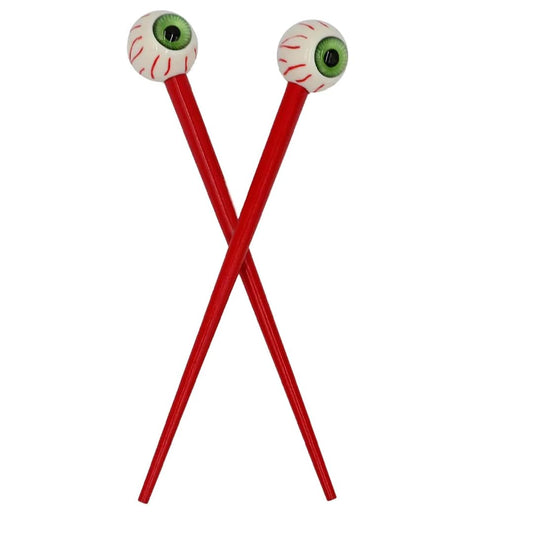 Kreepsville 666 creepy green eye ball hair sticks close-up, a bold gothic accessory for Halloween looks