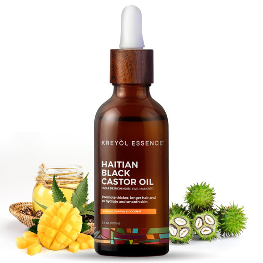KREYÒL ESSENCE Haitian Black Castor Oil bottle on display for skin and hair care.