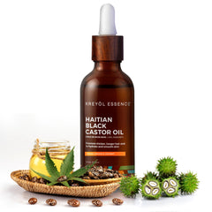KREYÒL ESSENCE oil on hand showing silky texture for quick absorption.