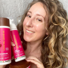 Kreyol Essence bottle featuring quinoa and baobab for strength and shine
