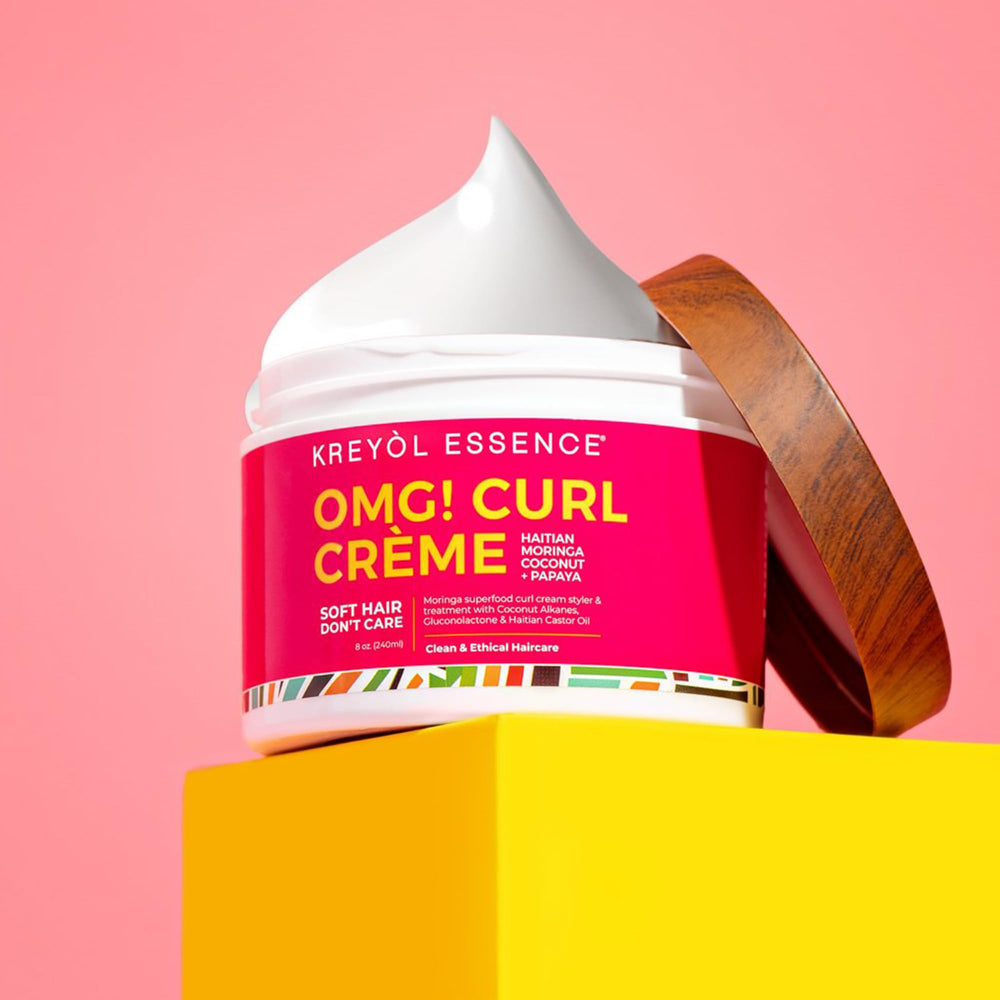 Kreyol Essence wet-hair application scene showing curl definition and hold.