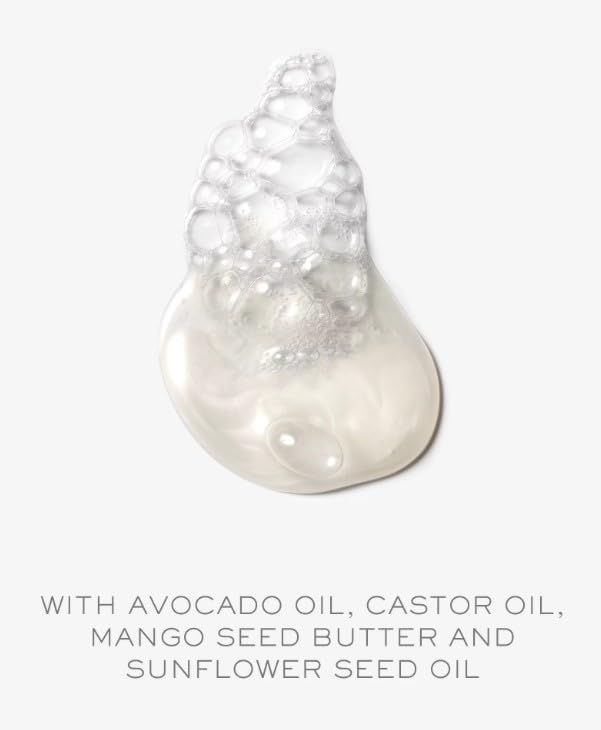 Kristin Ess shampoo foam demonstrates cleansing action on hair.