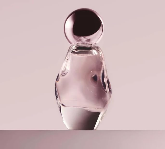 Kylie Cosmic EDP bottle highlights ambery floral notes for versatile wear.