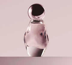 Kylie Cosmic EDP bottle highlights ambery floral notes for versatile wear.
