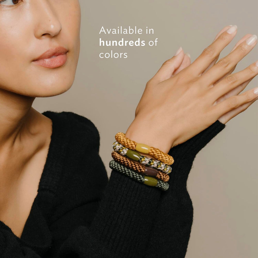Gift-ready L. Erickson hair ties in stylish metallic tones.