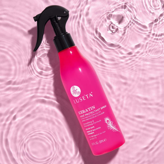 L Luseta Keartin spray mist on damp hair for even heat protection.