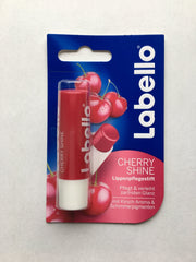Labello Cherry Shine lip balm tube with soft pink glow.