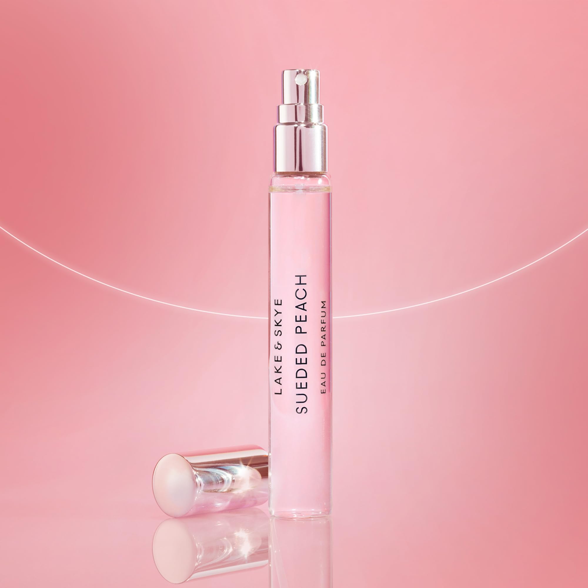 Lake & Skye Sueded Peach purse spray cap close-up, showcasing sleek, compact design