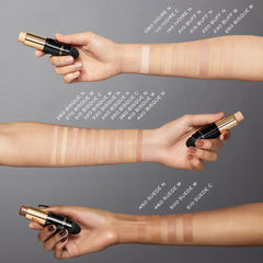 Cream-to-powder texture of Lancôme foundation stick delivering natural matte finish.