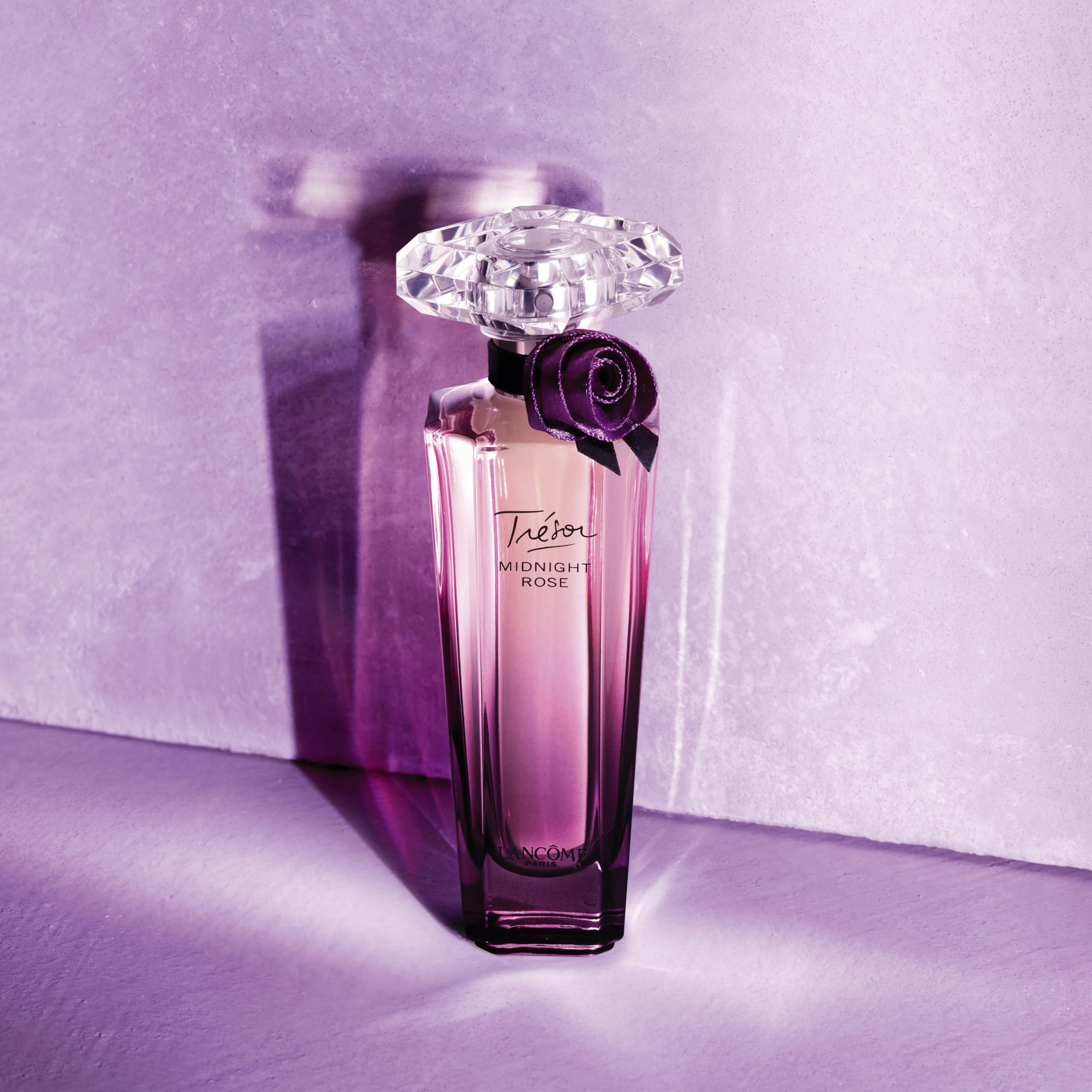 Lancôme Trésor Midnight bottle with warm floral fragrance for evenings.