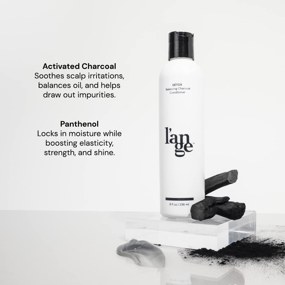 L'ANGE HAIR Detox Charcoal Conditioner bottle pour showing easy even coverage.