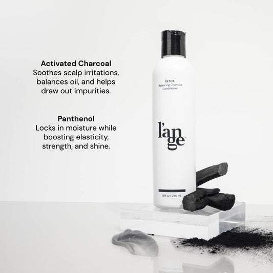 L'ANGE HAIR Detox Charcoal Conditioner bottle pour showing easy even coverage.