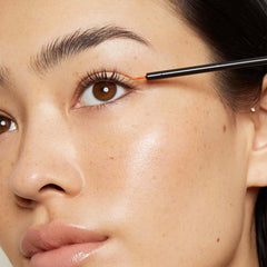 LashFood serum close-up applying along lash line for targeted care.