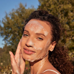 LATHER Ultra Mild Face Wash ingredients scene with coconut oil and shea butter for gentle cleansing.
