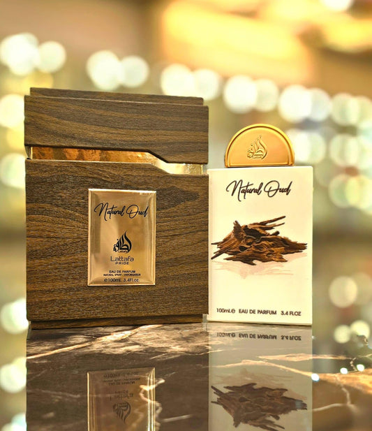 Lattafa Pride Natural Oud spray close-up highlighting its rich, long-lasting aroma.