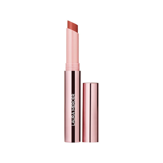 Laura Mercier High Vibe Lip Color bottle shows luminous coral shade and premium finish